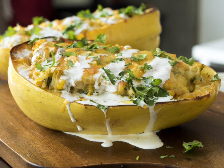 A bowl of food with a dollop of sour cream on top.
